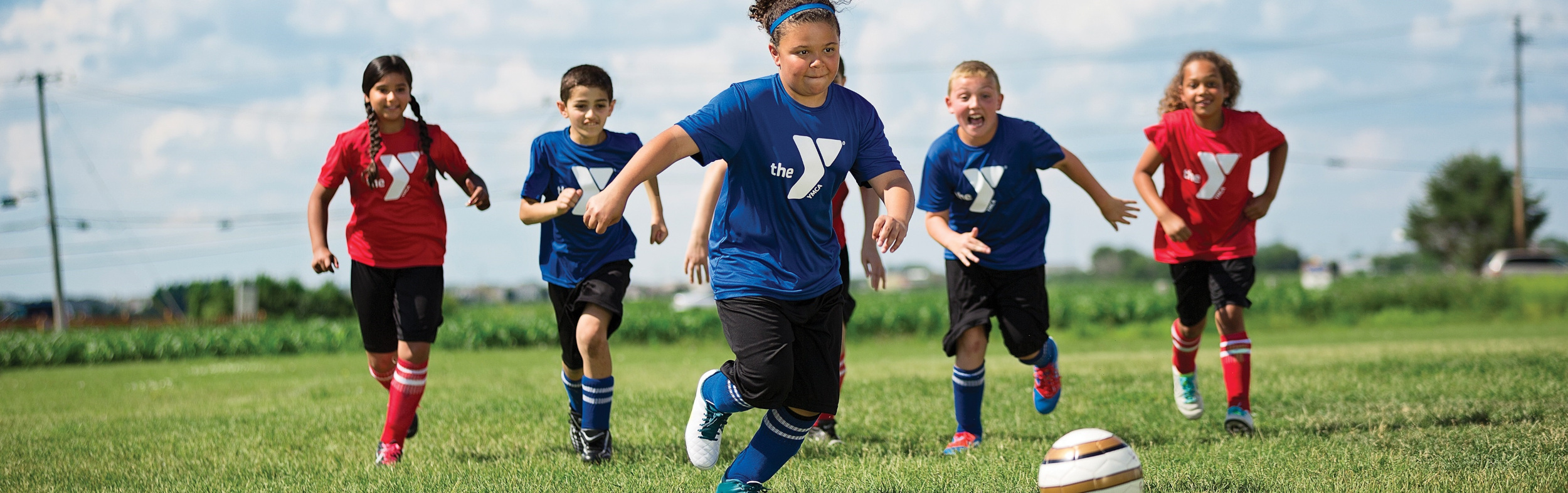 A group of children playing soccer.