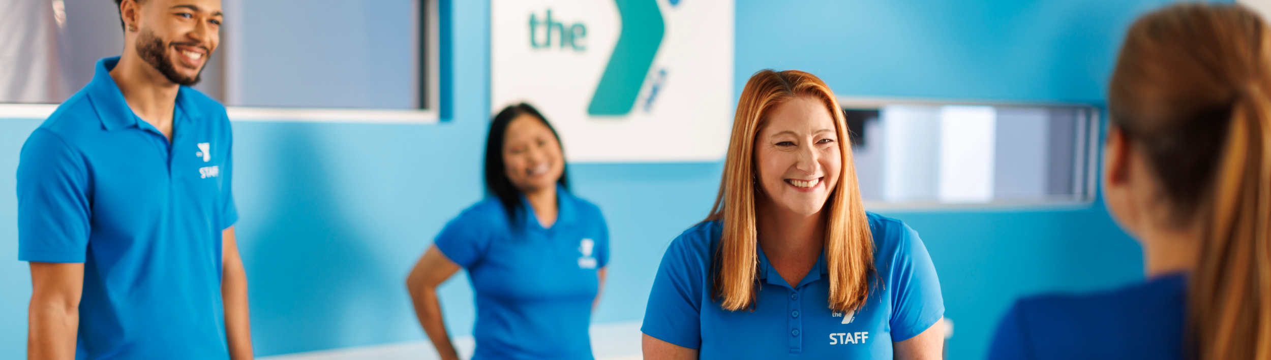 YMCA Staff helping a member.