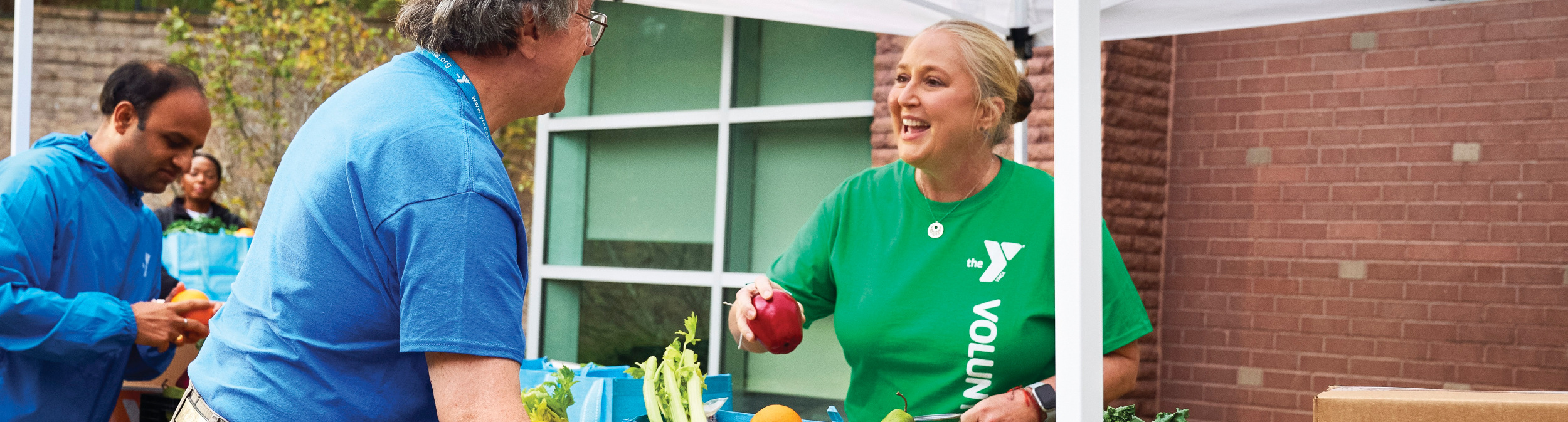 YMCA member volunteering at food drive.